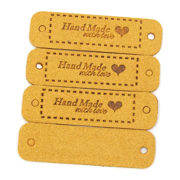A set of two tan leather-style handmade with love tags for crafts and sewing.