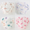 A set of four reusable cotton potty training pants for toddlers in various pastel patterns.