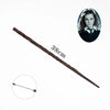 A long, slender brown metal magic wand next to a portrait of a young woman.