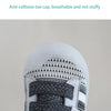 Close-up detail display of a white toddler shoe upper with gray mesh and strap features.