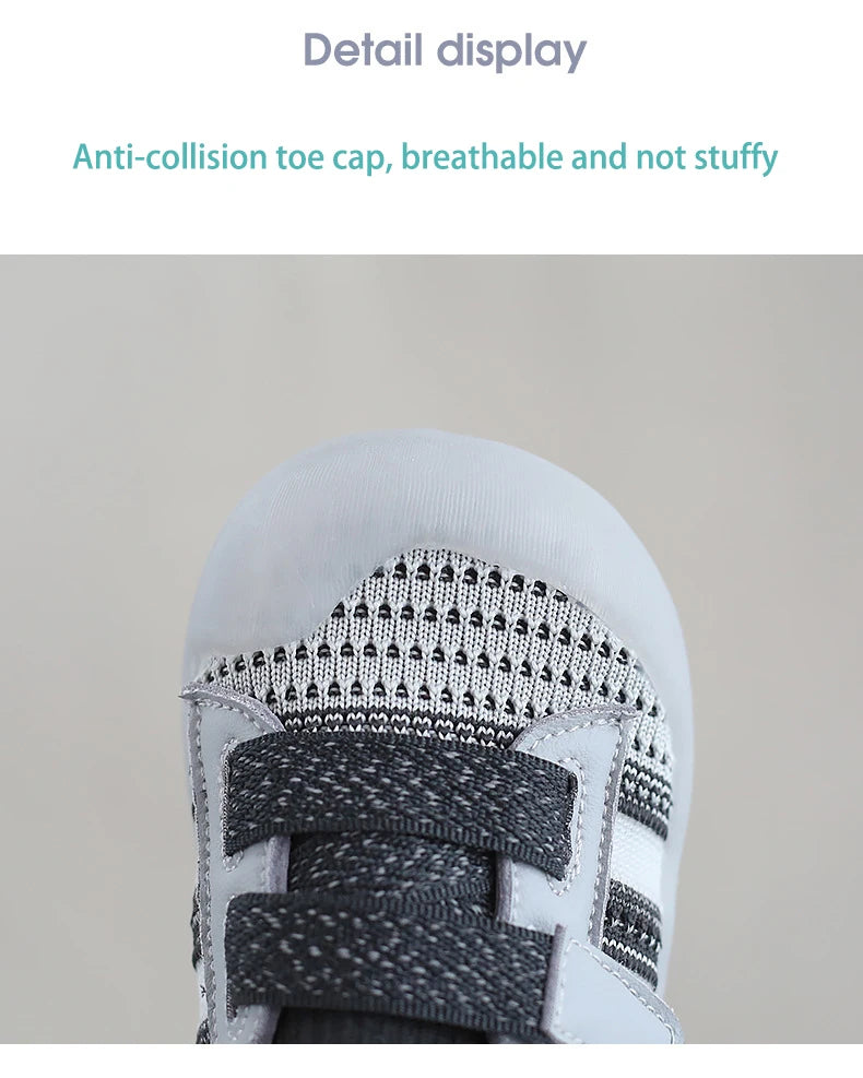 Close-up detail display of a white toddler shoe upper with gray mesh and strap features.