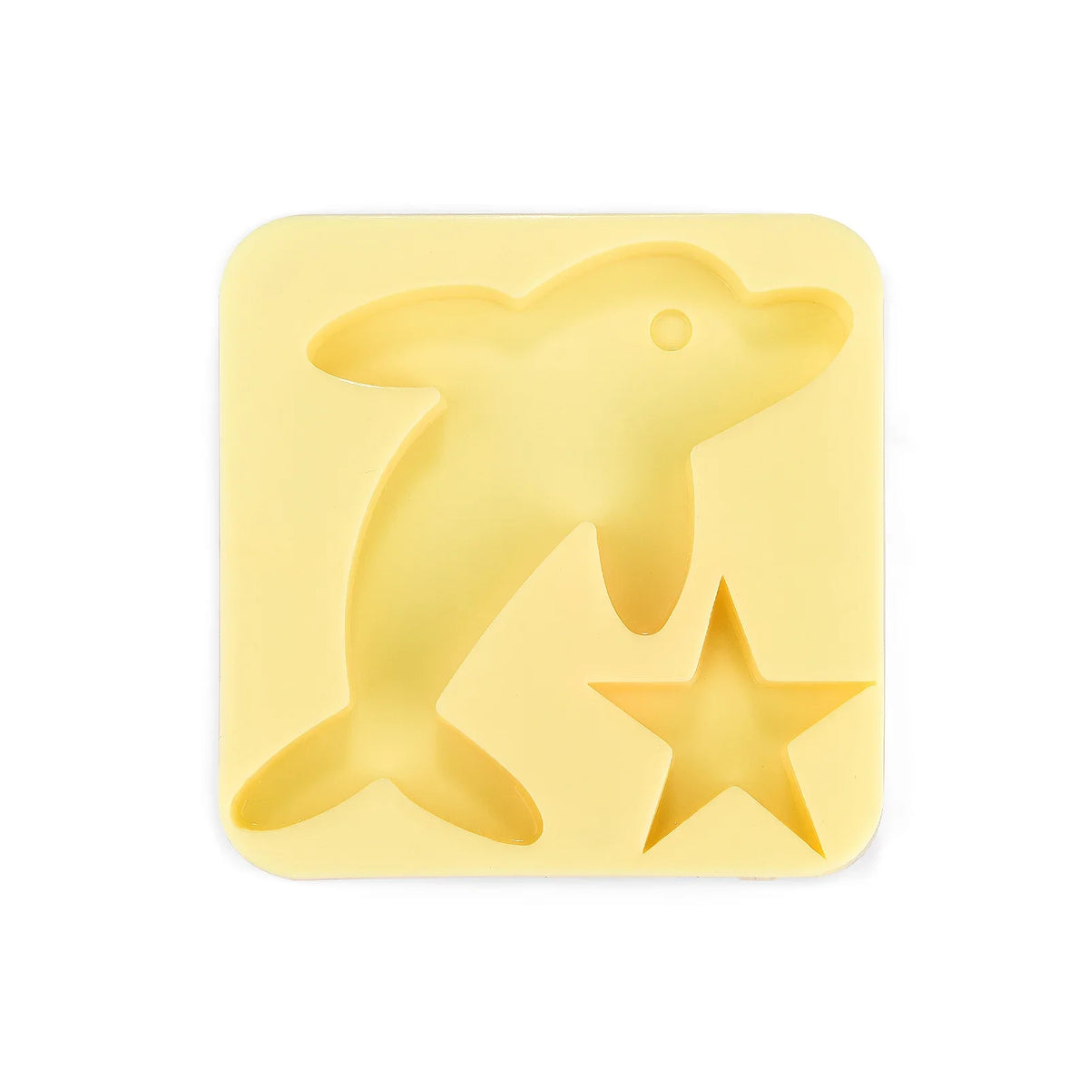 A yellow silicone mold shaped like a dolphin and a star for a DIY craft kit.