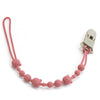 A pink silicone pacifier clip with a loop and a clip mechanism for babies.