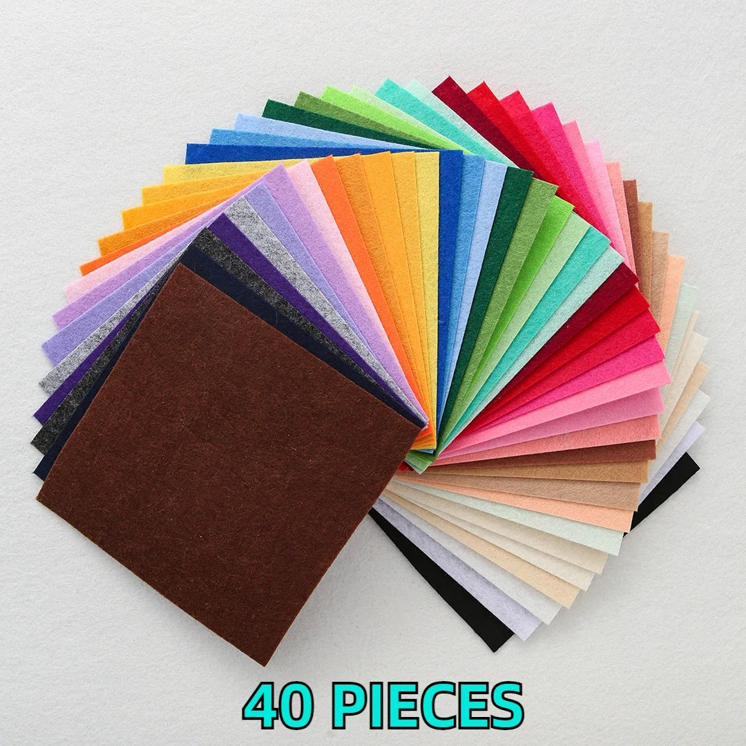 A fan of colorful non-woven felt fabric sheets in various shades of green, blue, purple, orange, and pink.