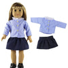 A doll wearing a blue and white gingham outfit with a white collar, including a top and skirt.