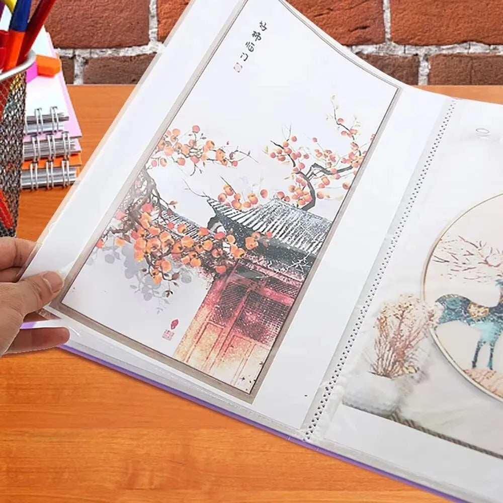 A transparent diamond painting storage album displaying an illustration of a traditional Japanese gate with blooming orange f