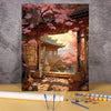 A paint by numbers kit depicting a traditional Japanese wooden house and flower field landscape with pink blossoms.