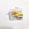 A clear plastic package containing a set of miniature food items including steak, salmon, and bacon rolls.