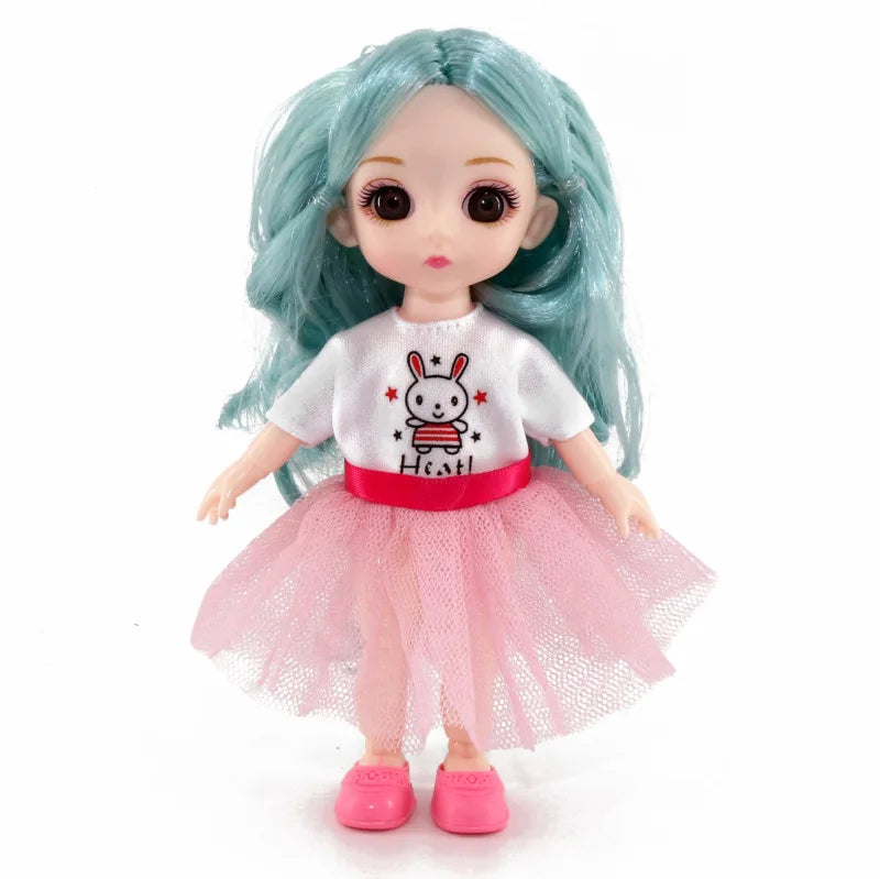 A 16cm articulated BJD princess doll with light blue hair wearing a white shirt and pink tutu skirt.