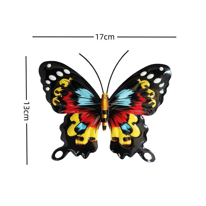 A set of four decorative iron butterfly wall art pieces featuring vibrant red, yellow, and blue wings.