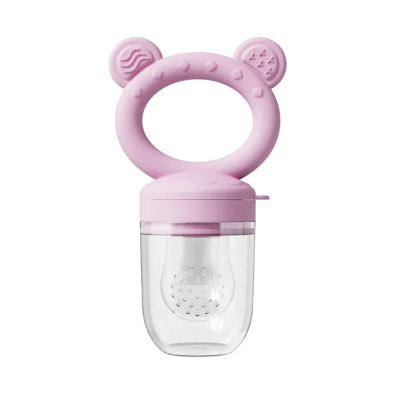 A pink silicone fruit food feeder and cooling mold set with a clear container.