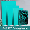 A stack of teal PVC carving blocks with a dark tree design on the top block.