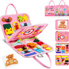 A pink Montessori busy board for toddlers featuring various sensory and learning activities like puzzles, buttons, and life s