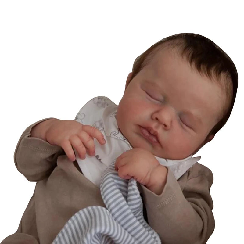 A realistic 19-inch silicone reborn baby doll of a newborn boy with rooted hair, sleeping.