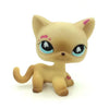 A light tan Littlest Pet Shop style standing dog figure with pink markings.