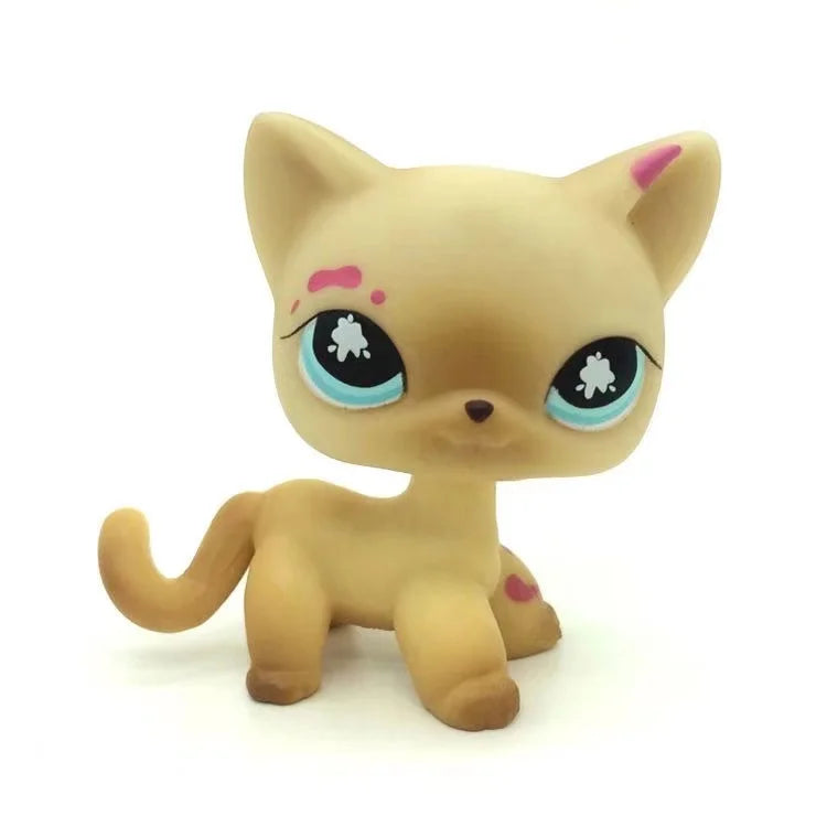 A light tan Littlest Pet Shop style standing dog figure with pink markings.