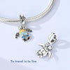 Sterling silver charm pendant set featuring starfish, sea turtle, and whale shark designs on a silver chain.