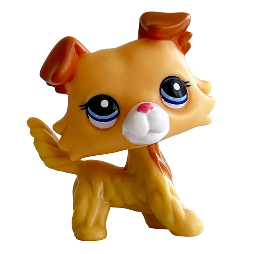 A yellow bobblehead toy shaped like a deer with large blue eyes and reddish-brown ears.