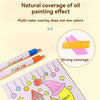 A set of silky crayon sticks in various colors is shown next to a drawing on paper demonstrating strong coverage.