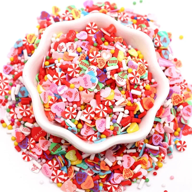 A pile of colorful polymer clay sprinkles mix in various shapes and colors for slime decor and DIY crafts.
