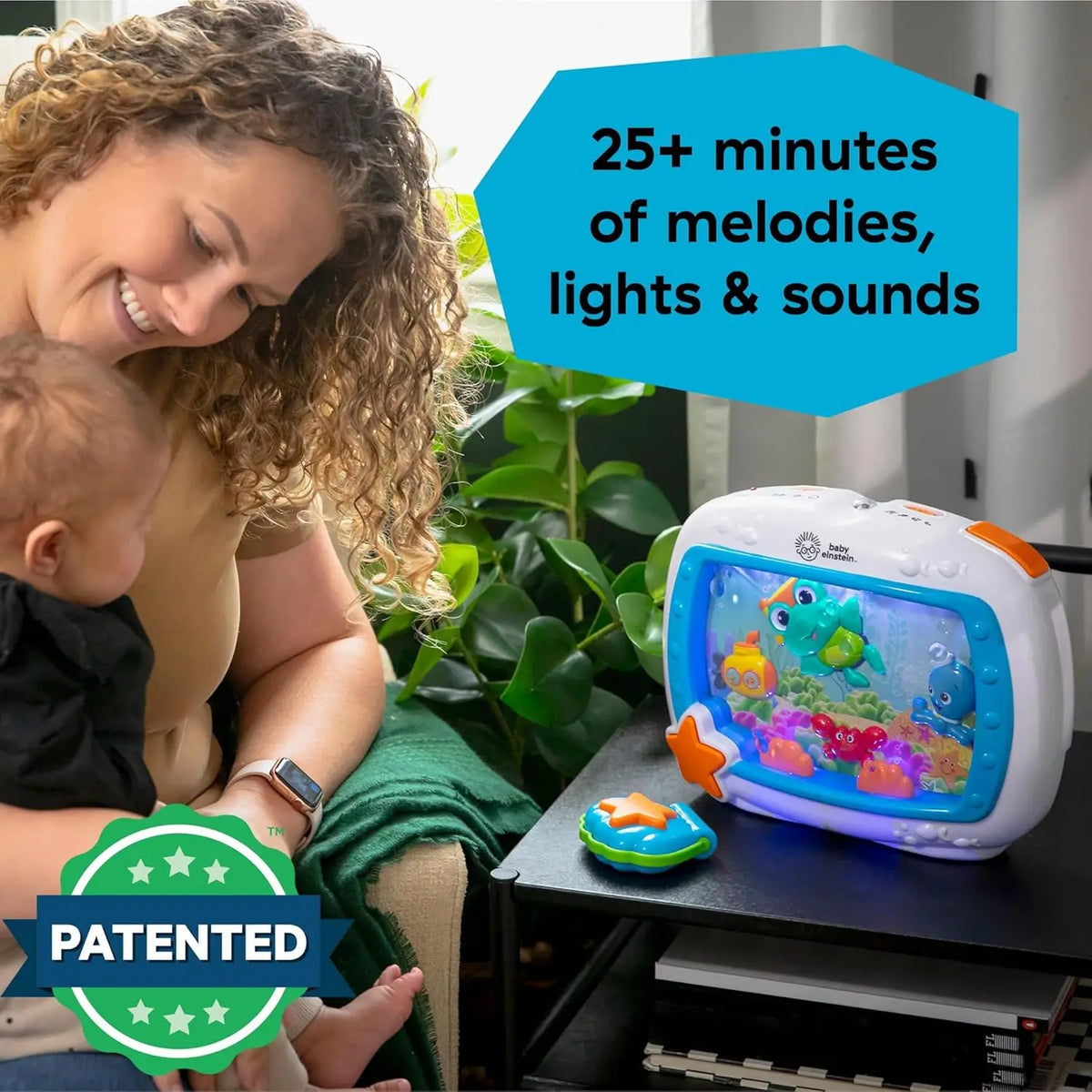 An ocean-themed crib soother with remote, lights, and melodies is shown next to a baby.