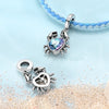 Sterling silver ocean life charm pendant set featuring starfish, sea turtle, and whale shark charms on a blue beaded necklace