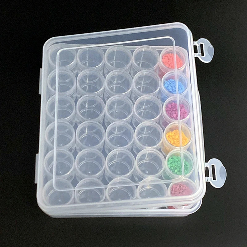 A clear plastic storage container holds 30 round bottles of various colored liquid or solid materials.