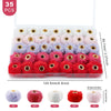 A pack of 35 plush fur pom pom beads in various colors like pink, purple, and red for jewelry making.