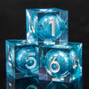 A set of blue resin dice showing the number one and six, inspired by Lord of the Rings.