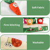 Close-up of a soft orange carrot pull toy with firm stitching and a washable fabric detail.