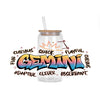 A clear glass bottle with a straw contains liquid and features colorful graffiti text spelling out GEMINI surrounded by zodia
