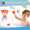 A young boy is playing with an orange basketball hoop and ball in a bathtub filled with water.