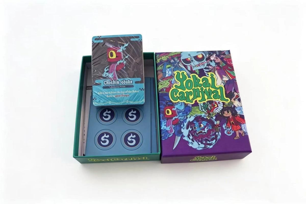 A set of Yokai Carnival strategic board games including a box and game components.