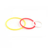 Three colored rubber bands, yellow, red, and white, laid out on a white background.