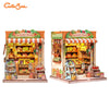 A wooden book nook kit depicting a grocery store with produce and goods, featuring LED lighting.