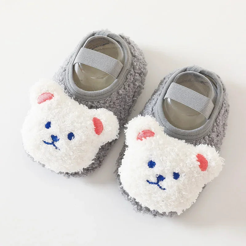 Pair of soft gray and white cartoon bear baby booties for infants