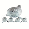 A plush seal family pillow featuring one large adult seal and four smaller baby seals.
