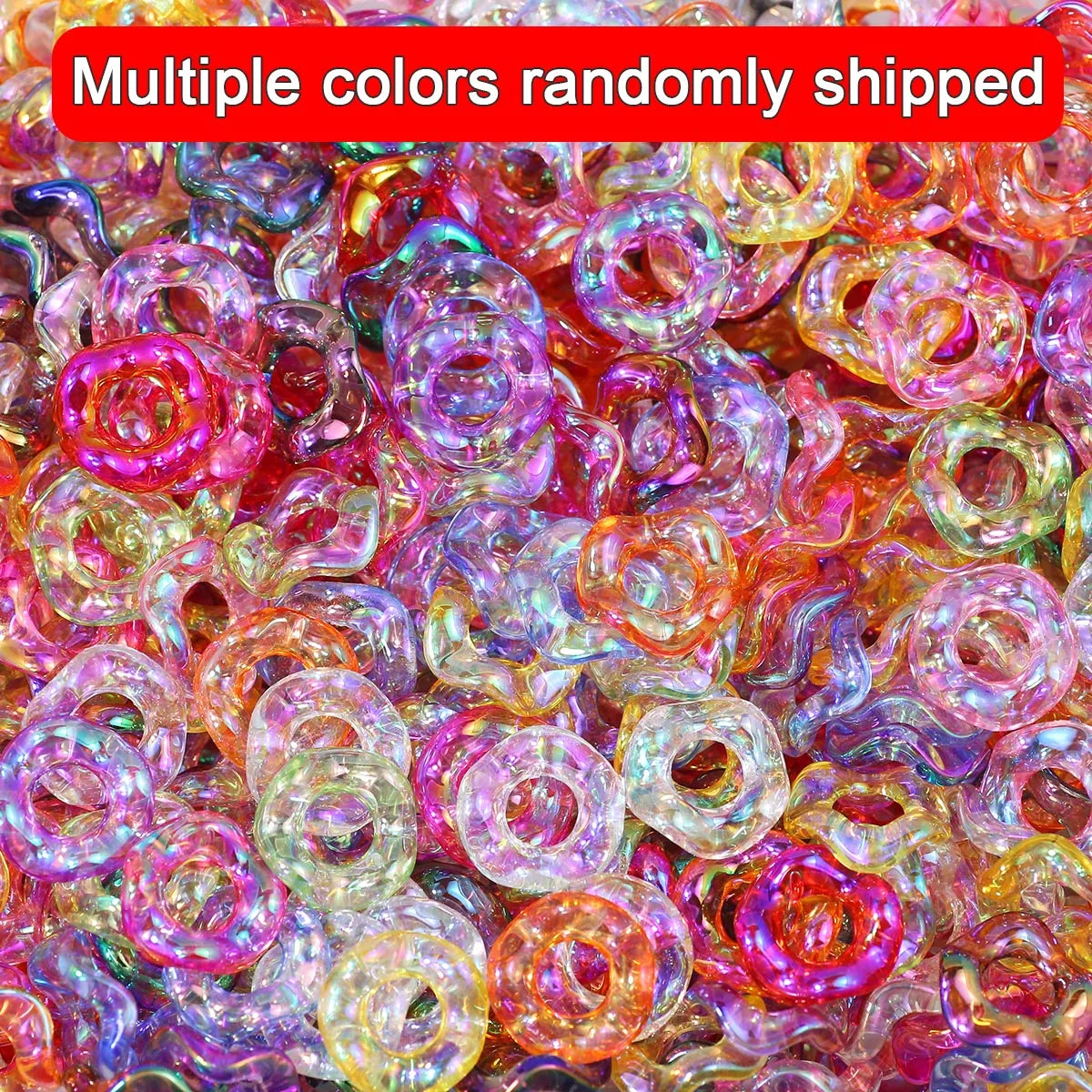 A close-up of multiple colors of wave-patterned acrylic beads randomly shipped for jewelry making
