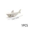 A white plastic model of a marine creature used as an ocean animal building block.