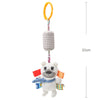 A white bear plush toy with a yellow ring hanger and colorful fabric accents.