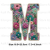 A large embroidered letter M made of floral fabric patches for DIY clothing and accessories