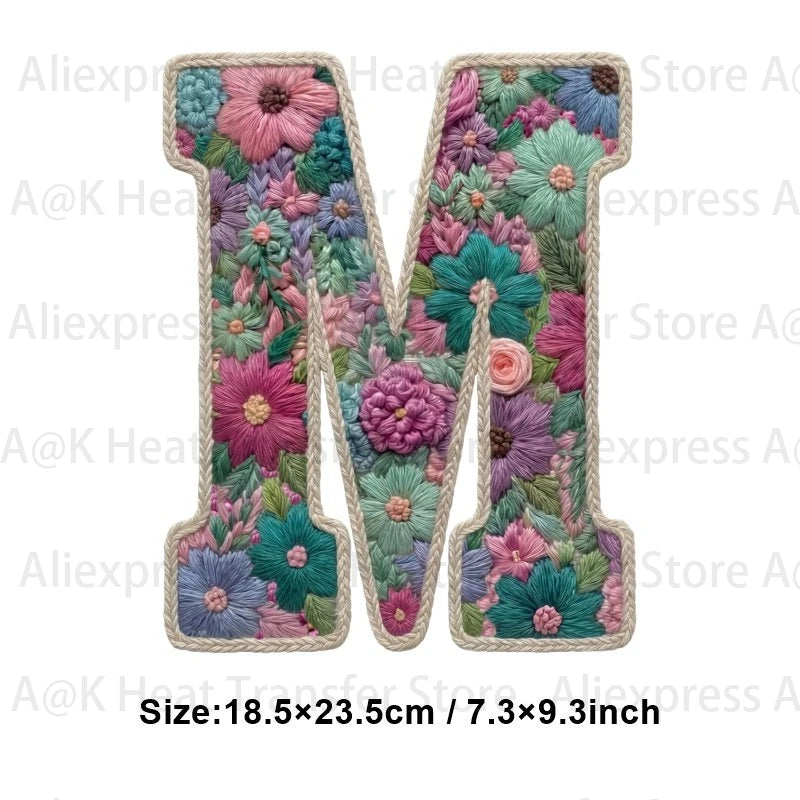 A large embroidered letter M made of floral fabric patches for DIY clothing and accessories