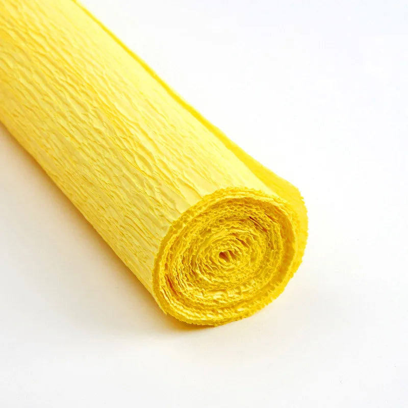 A roll of bright yellow crepe paper for DIY crafts and gift wrapping.
