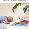 A hand holds a white electric diamond painting pen over a canvas featuring a colorful landscape.