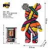 A colorful bear figure made of micro building blocks, featuring graffiti art patterns.