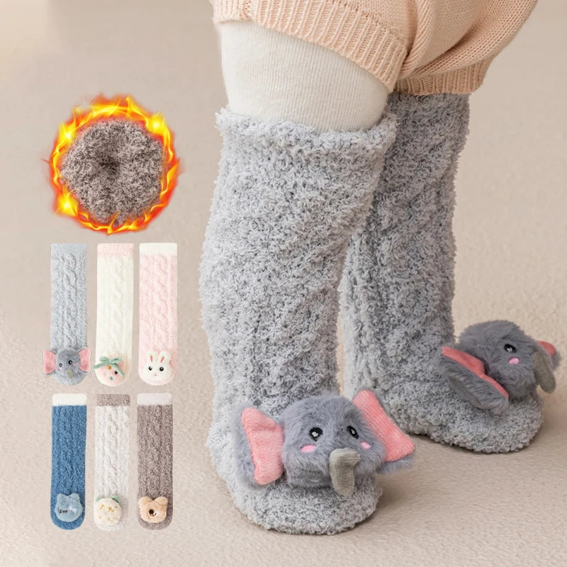 Gray plush baby knee-high socks with elephant ears and a flame graphic.