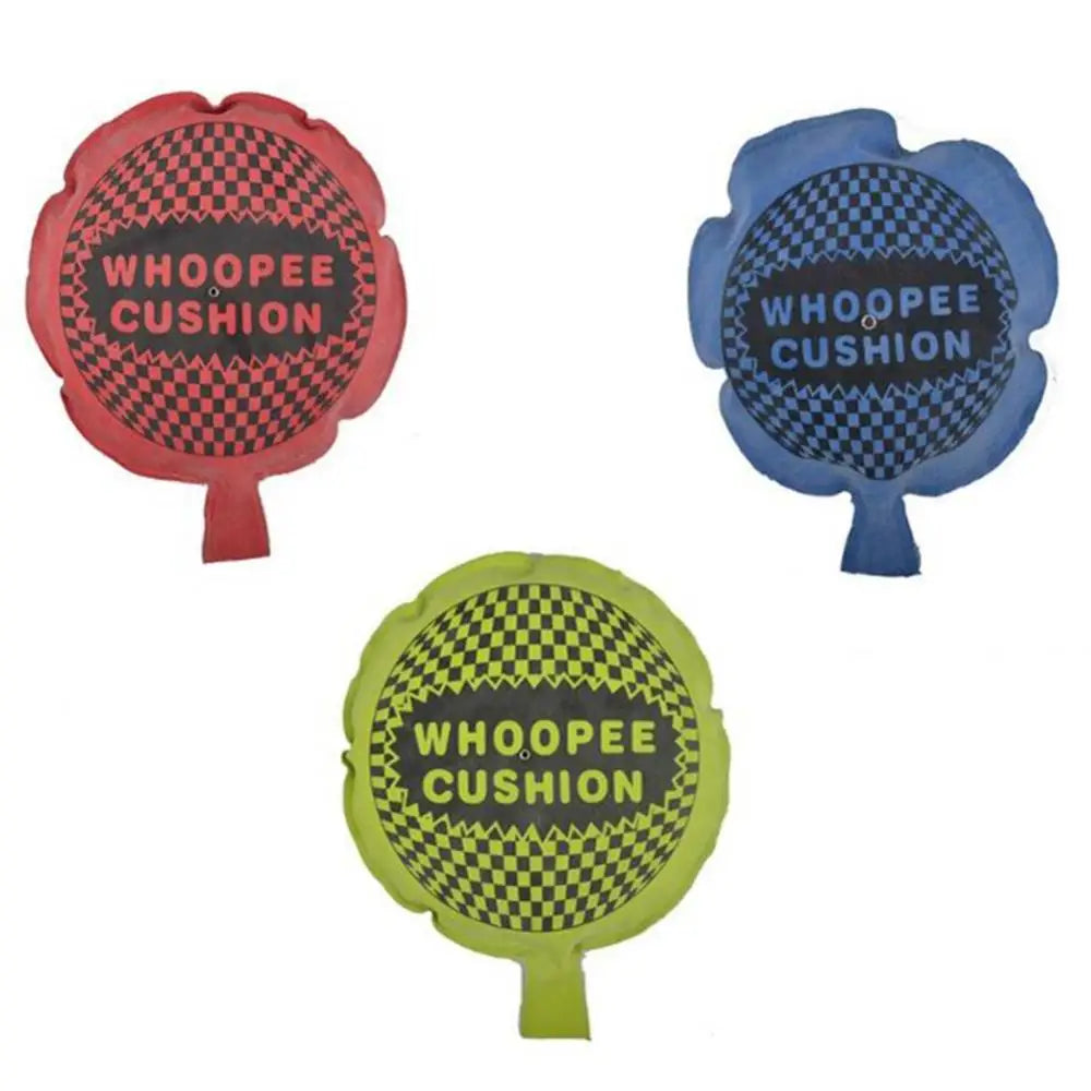 Three colorful Whoopee Cushion joke toys in red, blue, and lime green.