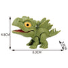 A green finger dinosaur fidget toy with movable joints and a yellow eye, shown from the side.