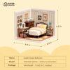 A miniature dollhouse kit of a sweet dream bedroom featuring wooden furniture and bedding.
