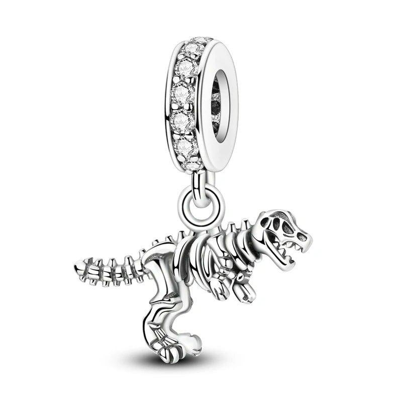 Sterling silver charm beads featuring a detailed dinosaur skeleton design.